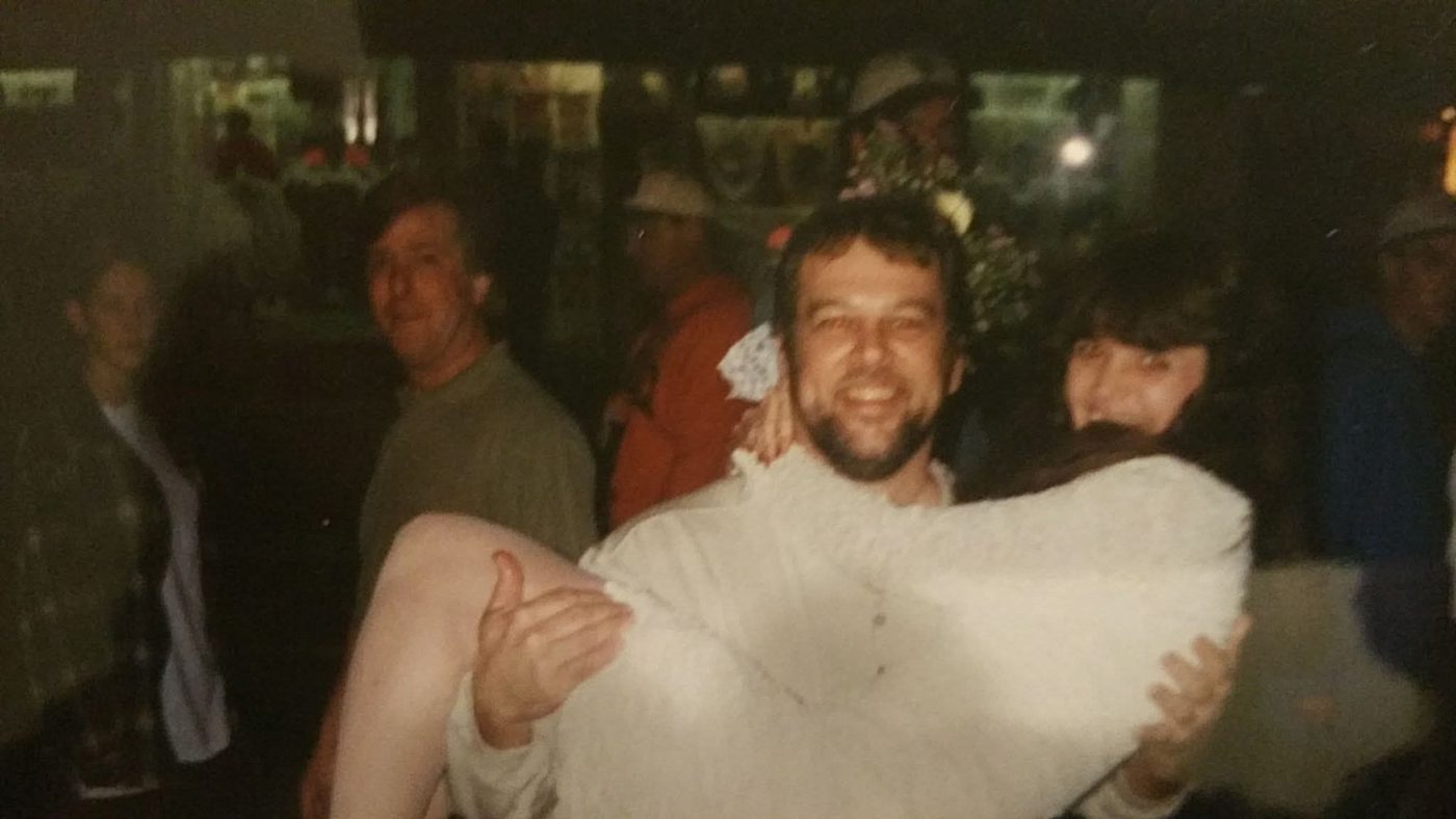 James carrying Kathi over the threshold at Sloppy Joe's in Key West on their wedding day.