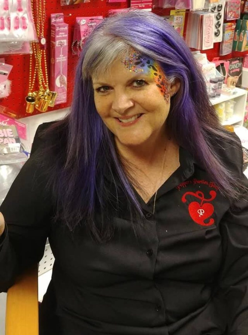 Kathi Pepper behind the counter of the Pepper's Parties boutique.